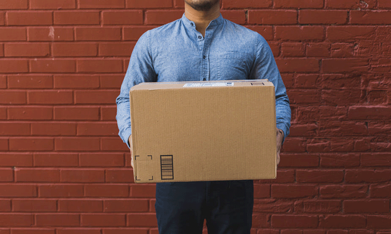 Man holding shipping box
